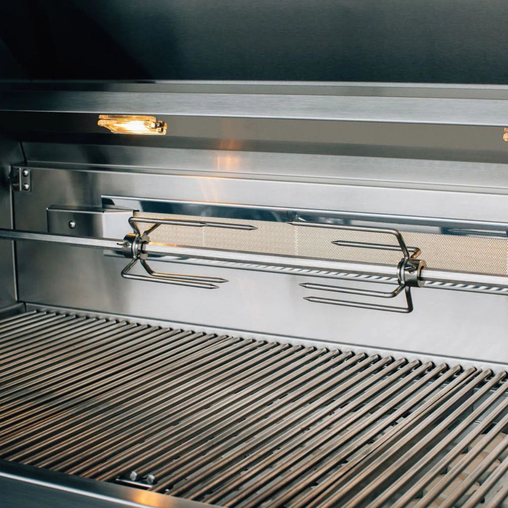 Close-up of a stainless steel grill interior with a rotisserie spit assembly and grill grates.