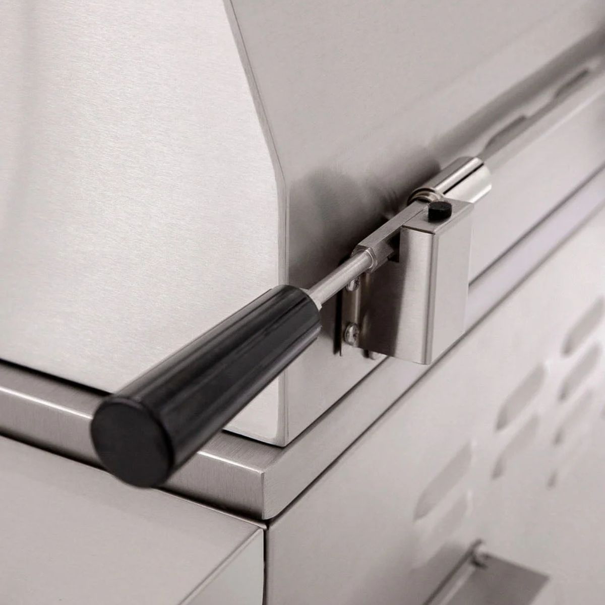 Close-up of a shower door handle and mechanism on a glass panel.