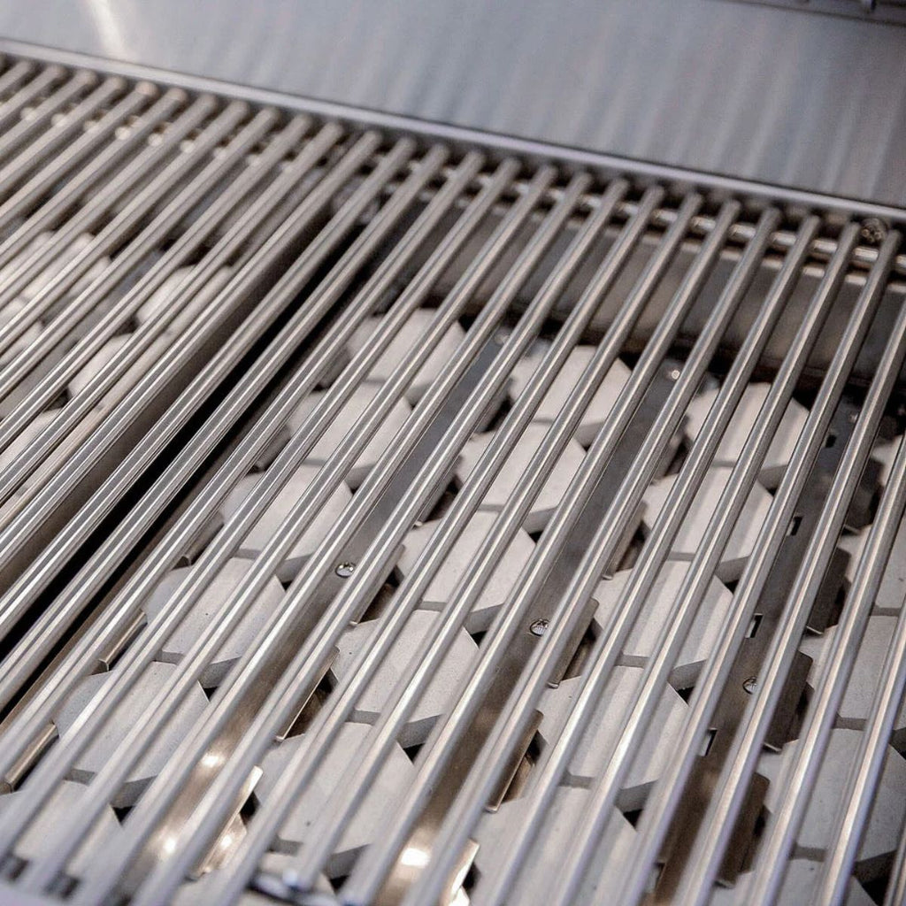 Close-up of stainless steel grill grates with parallel metal bars over a cooking grate surface.