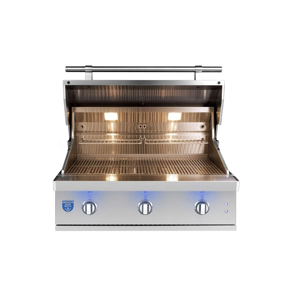 A stainless steel outdoor gas grill with its lid open, showing the interior grates and burners. The grill features three control knobs on the front with blue flame indicators and a blue brand badge on the lower left.