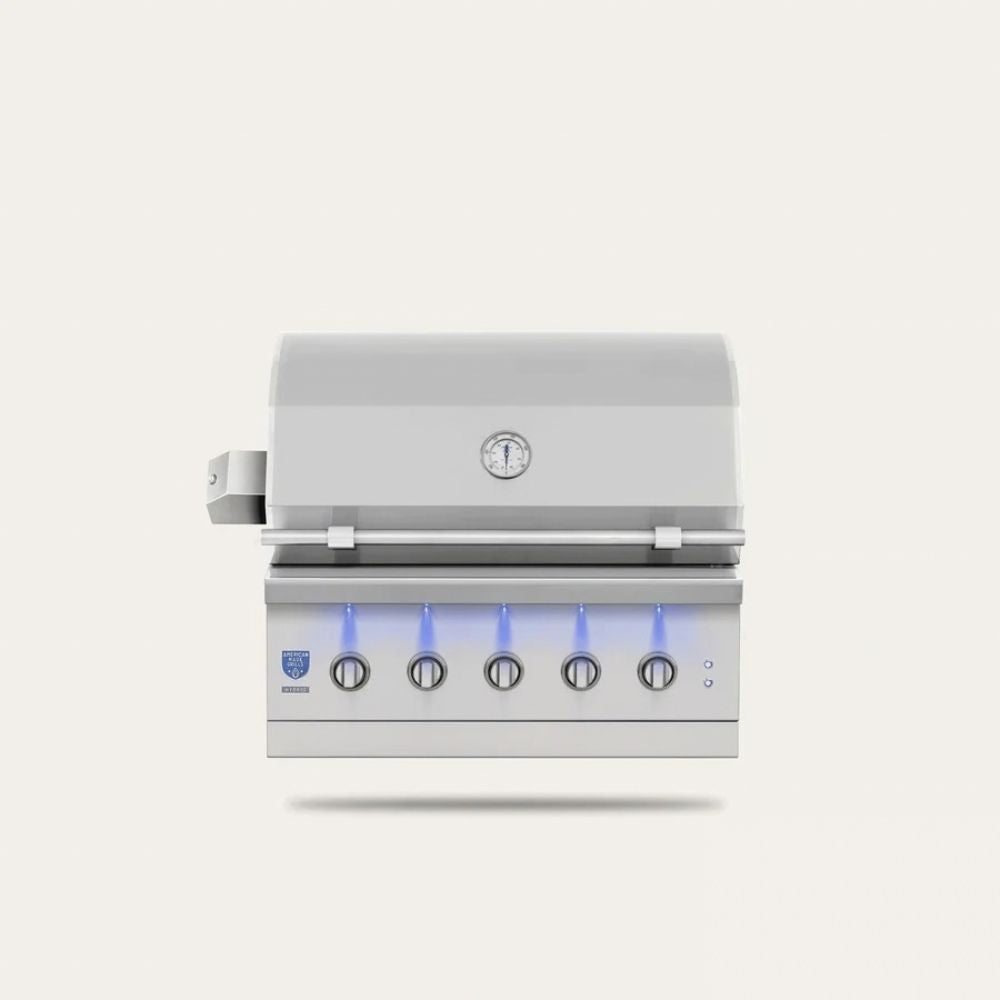 A stainless steel 4-burner outdoor gas grill with a closed lid, featuring a digital temperature gauge on the lid, five control knobs on the front panel with blue indicator lights, and a small blue logo on the lower left.
