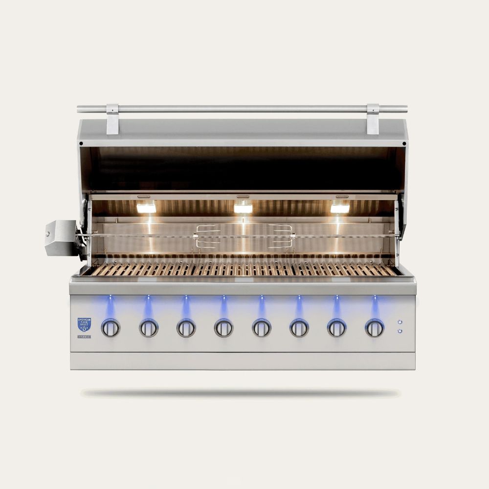 A stainless steel 8-burn outdoor gas grill with its lid open, showing the lit interior grates and control knobs with blue flame indicators, set against a light beige background.