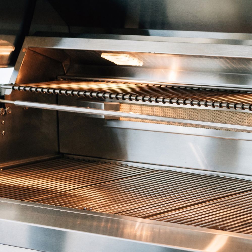 Stainless steel oven interior with glowing heating elements