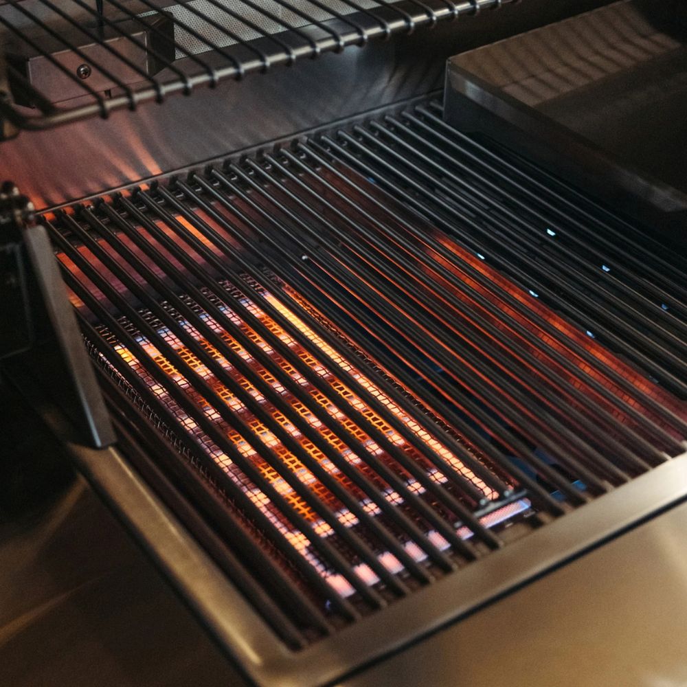 Close-up of a hot grill with glowing coals