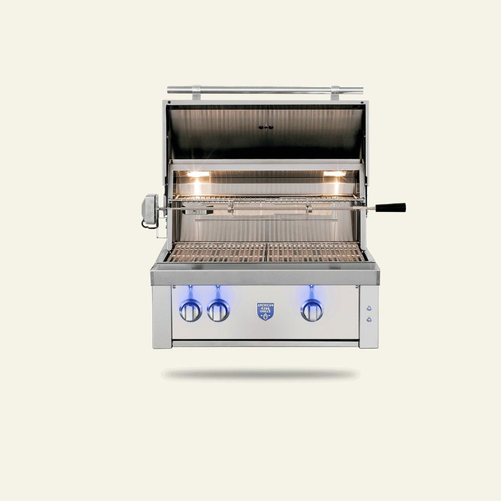 Stainless steel grill with three control knobs on a light beige background