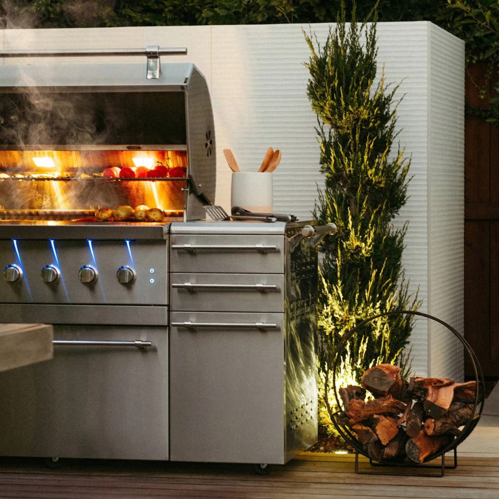 Outdoor kitchen with a grill and decorative elements