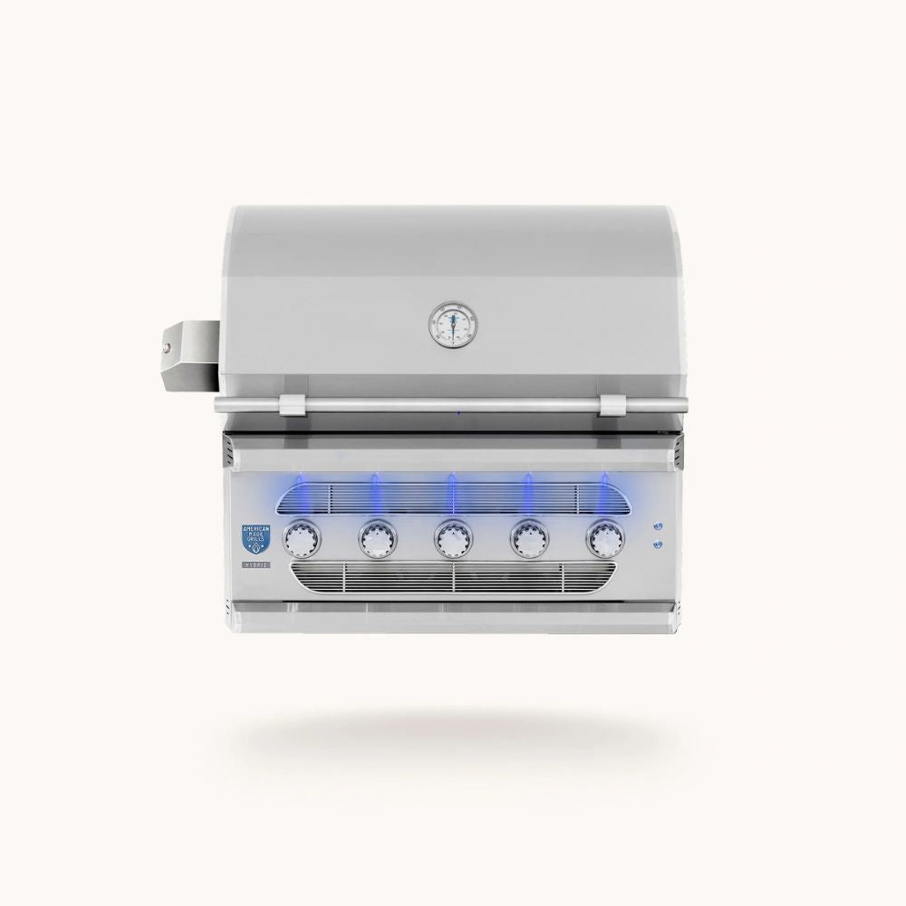 A stainless steel 5-burn outdoor gas grill with a lid, four control knobs, and blue glow accents under the lid, shown against a solid off-white background.
