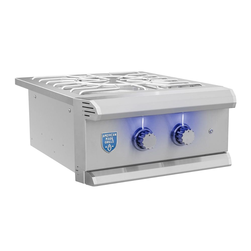 Stainless steel outdoor kitchen range with two burners and control knobs on a white background.