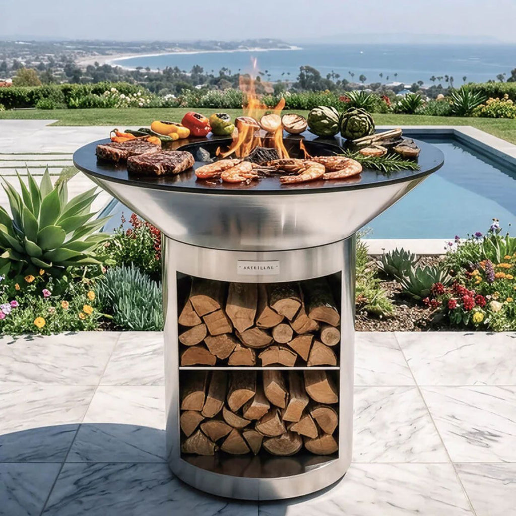 Outdoor grill with food and firewood, set against a scenic backdrop with a pool and garden.