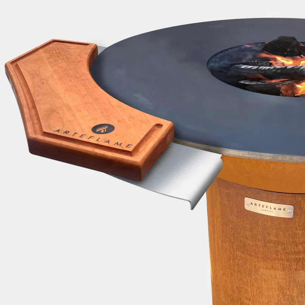 Wooden fire pit with blue interior and visible 'ARTEFLAME' branding on a white background