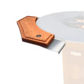 Wooden pizza peel with metal blade on a white background