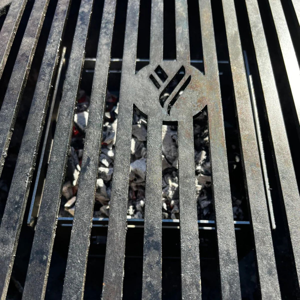 Close-up of a metal grill with a brand logo on it