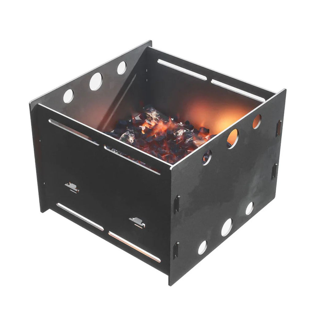 Black metal fire pit with glowing embers on a white background