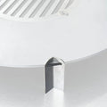 Close-up of a white ceiling light fixture with a metallic trim.