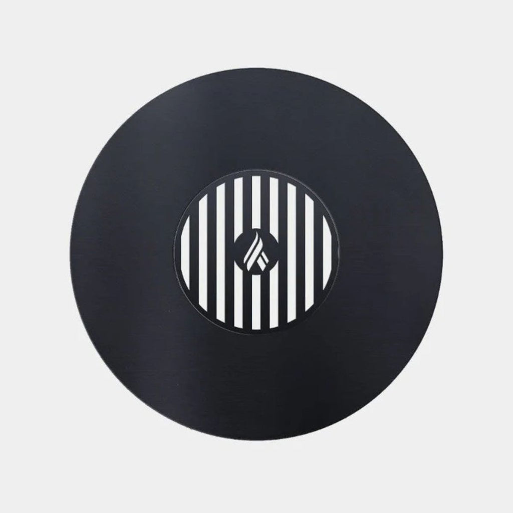 Black vinyl record with a white and black striped center on a light gray background