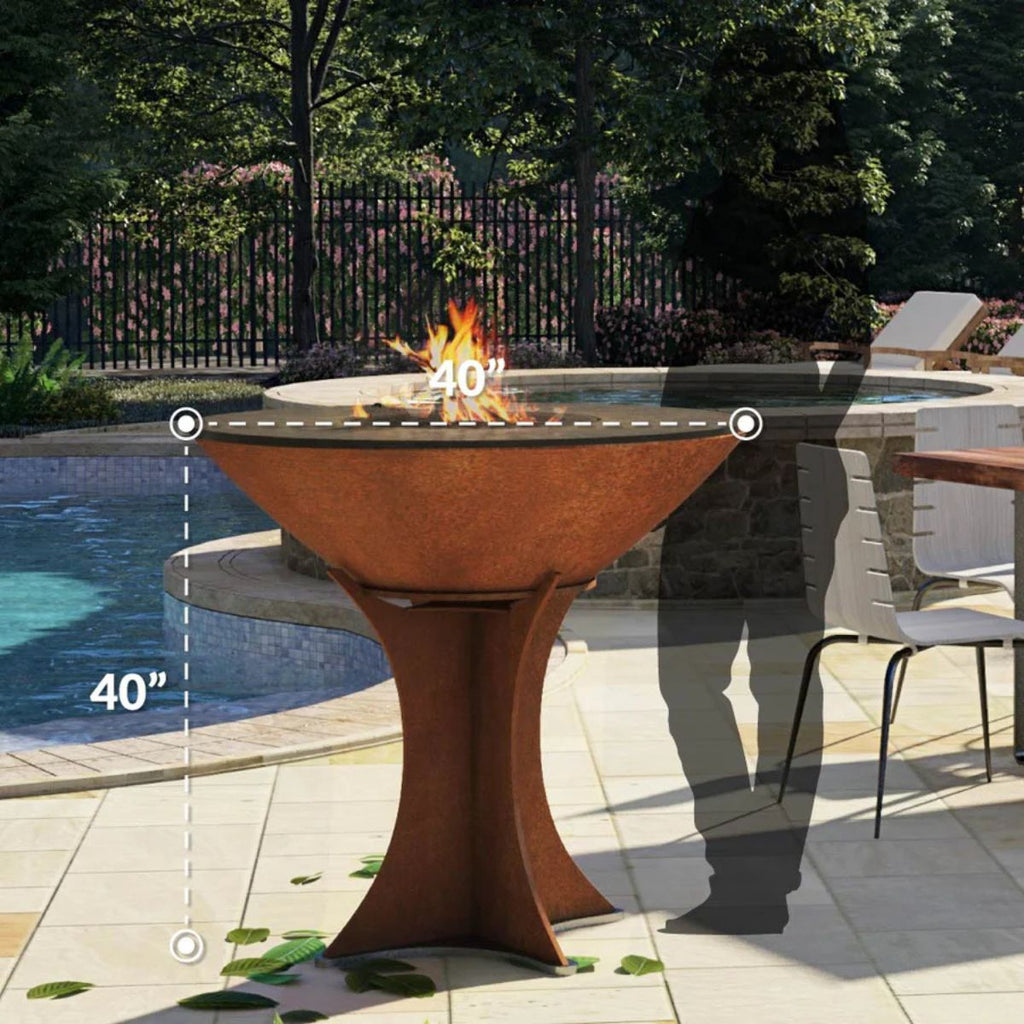 Outdoor fire pit table with flames, surrounded by a pool and patio area.